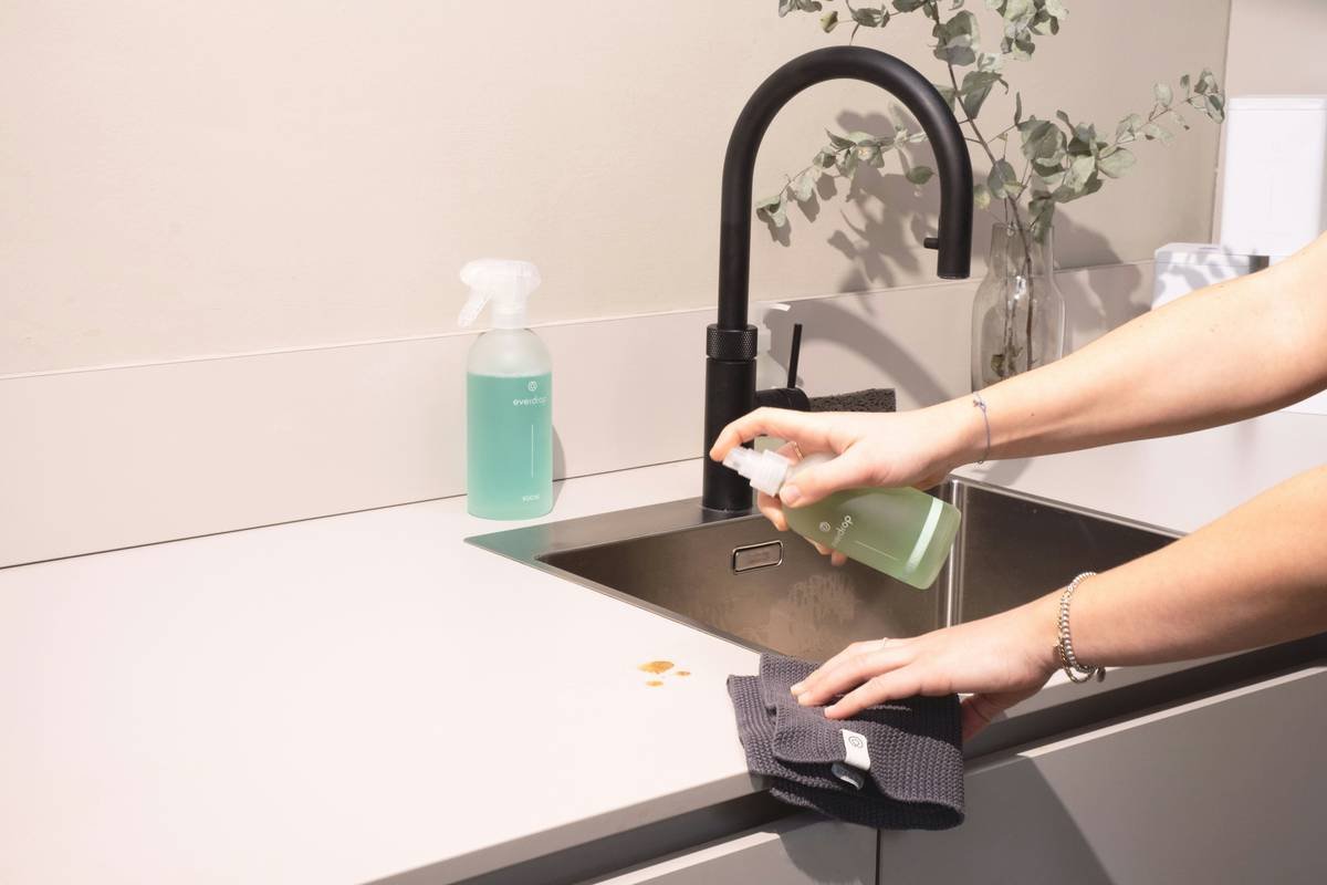 Close-up of cleaning a stylish hair clip clasp with alcohol swab to restore grip