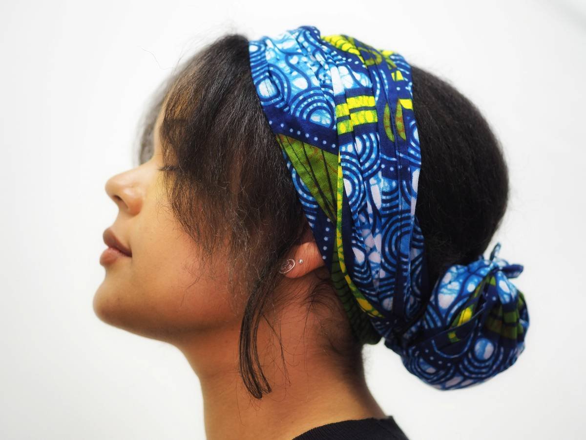 Close-up of double-knot technique on boho head covering showing secure hold